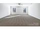 Large bedroom with plush carpeting and ceiling fan at 14916 Oregon Oak Ct, Mint Hill, NC 28227