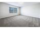 Simple bedroom with neutral walls and gray carpeting at 14916 Oregon Oak Ct, Mint Hill, NC 28227