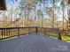 Wooden deck overlooking a wooded backyard at 14916 Oregon Oak Ct, Mint Hill, NC 28227