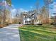 House with a driveway and a well-manicured lawn at 14916 Oregon Oak Ct, Mint Hill, NC 28227