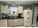 Modern kitchen with granite countertops, stainless steel appliances, and light-grey colored floors at 1668 Sandpiper Dr, Rock Hill, SC 29732