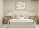 Serene bedroom with a king-size bed, nightstands, and lamps at 1811 Otter Perch Ln, Fort Mill, SC 29715