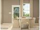 Dining room with a round table and beige chairs near sliding door at 1811 Otter Perch Ln, Fort Mill, SC 29715