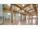 Large open common area with exposed beams and hardwood floors at 201 S Hoskins Rd # 122, Charlotte, NC 28208