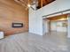 Open living area with exposed beams and fireplace at 201 S Hoskins Rd # 122, Charlotte, NC 28208