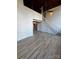 Open living room with loft and hardwood floors at 201 S Hoskins Rd # 122, Charlotte, NC 28208