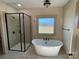 Bathroom with soaking tub, shower, and window at 226 Beths Ct, York, SC 29745