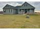 Inviting home with a covered porch and green siding, enhanced by a spacious front yard at 226 Beths Ct, York, SC 29745