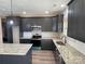 Modern kitchen with dark cabinets and granite countertops at 226 Beths Ct, York, SC 29745