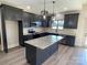 Modern kitchen with dark cabinets, granite countertops, and island at 226 Beths Ct, York, SC 29745