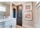 Modern bathroom with white vanity and dark door at 3226 Mcharney Dr # 35, Harrisburg, NC 28075