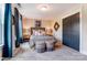 Bedroom with striped bedding and two ottomans at 3226 Mcharney Dr # 35, Harrisburg, NC 28075