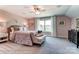 Main bedroom with pink walls and patterned bedding at 3226 Mcharney Dr # 35, Harrisburg, NC 28075