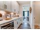 Well-equipped butler's pantry with white cabinets and quartz countertops at 3226 Mcharney Dr # 35, Harrisburg, NC 28075