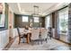 Formal dining room featuring a rustic wooden table and chandelier at 3226 Mcharney Dr # 35, Harrisburg, NC 28075