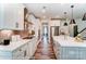 Modern kitchen with island, stainless steel appliances, and white cabinets at 3226 Mcharney Dr # 35, Harrisburg, NC 28075