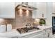 Modern kitchen with gas cooktop and stylish backsplash at 3226 Mcharney Dr # 35, Harrisburg, NC 28075