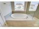 Relaxing bathroom with a large, free-standing soaking tub at 3229 Mcharney Dr # 35, Harrisburg, NC 28075