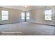 Bright bedroom with neutral walls and carpet at 3229 Mcharney Dr # 35, Harrisburg, NC 28075