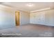 Large bedroom with double doors and carpet at 3229 Mcharney Dr # 35, Harrisburg, NC 28075