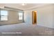 Spacious bedroom with walk-in closet and carpet at 3229 Mcharney Dr # 35, Harrisburg, NC 28075