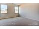 Bright bedroom with neutral walls and carpet at 3229 Mcharney Dr # 35, Harrisburg, NC 28075