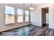 Bright dining area with hardwood floors and large windows at 3229 Mcharney Dr # 35, Harrisburg, NC 28075