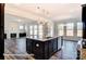 Kitchen island with granite countertop and stainless steel appliances at 3229 Mcharney Dr # 35, Harrisburg, NC 28075