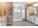 Bathroom with white tile shower, built in seat, and double vanity at 3237 Mcharney Dr # 29, Harrisburg, NC 28075