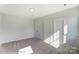 Spacious bedroom with double doors and plush carpeting at 3237 Mcharney Dr # 29, Harrisburg, NC 28075