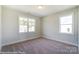 Simple bedroom with neutral walls and carpet at 3237 Mcharney Dr # 29, Harrisburg, NC 28075