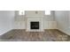 Elegant fireplace with white mantel and built-in shelving at 3237 Mcharney Dr # 29, Harrisburg, NC 28075