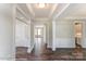 Bright hallway with hardwood floors, leading to rooms at 3237 Mcharney Dr # 29, Harrisburg, NC 28075