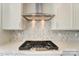 Gas cooktop and modern range hood in kitchen at 3237 Mcharney Dr # 29, Harrisburg, NC 28075