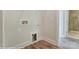 Convenient laundry room with hookups and shelving at 3237 Mcharney Dr # 29, Harrisburg, NC 28075