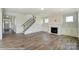 Spacious living room with fireplace and hardwood floors at 3237 Mcharney Dr # 29, Harrisburg, NC 28075