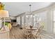 Charming dining area with light wood table and chairs, adjacent to a cozy living space at 415 Cameron Dr, Salisbury, NC 28147