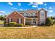 Brick two-story house with a large front yard and landscaping at 415 Cameron Dr, Salisbury, NC 28147