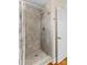 Shower stall with grey tile and glass door at 415 Cameron Dr, Salisbury, NC 28147