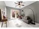 Bright bedroom with desk, chair, and access to a private patio at 420 Queens Rd # 6, Charlotte, NC 28207