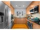 Modern kitchen with stainless steel appliances and wood cabinets at 420 Queens Rd # 6, Charlotte, NC 28207