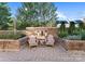 Stone patio with two chairs and a small table, offering a serene outdoor space at 420 Queens Rd # 6, Charlotte, NC 28207