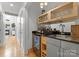 Modern wet bar with wine cooler and sink at 420 Queens Rd # 6, Charlotte, NC 28207