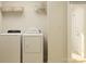 Convenient laundry room with washer, dryer, and shelving at 4552 Potters Wheel Dr, Fort Mill, SC 29715