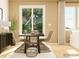 Casual dining area with rectangular table and wicker chairs at 4558 Potters Wheel Dr, Fort Mill, SC 29715