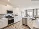 Modern kitchen with stainless steel appliances and white cabinetry at 4580 Potters Wheel Dr, Fort Mill, SC 29715