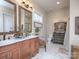 Double vanity bathroom with marble countertops and elegant mirrors at 600 E Monbo Rd, Statesville, NC 28677