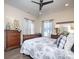 Sleigh bed, wood dresser, and ample natural light in this bedroom at 600 E Monbo Rd, Statesville, NC 28677