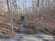 Small creek flowing through the woods at 600 E Monbo Rd, Statesville, NC 28677