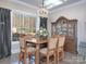 Bright dining room with a wood table, chairs, and view of the backyard at 600 E Monbo Rd, Statesville, NC 28677